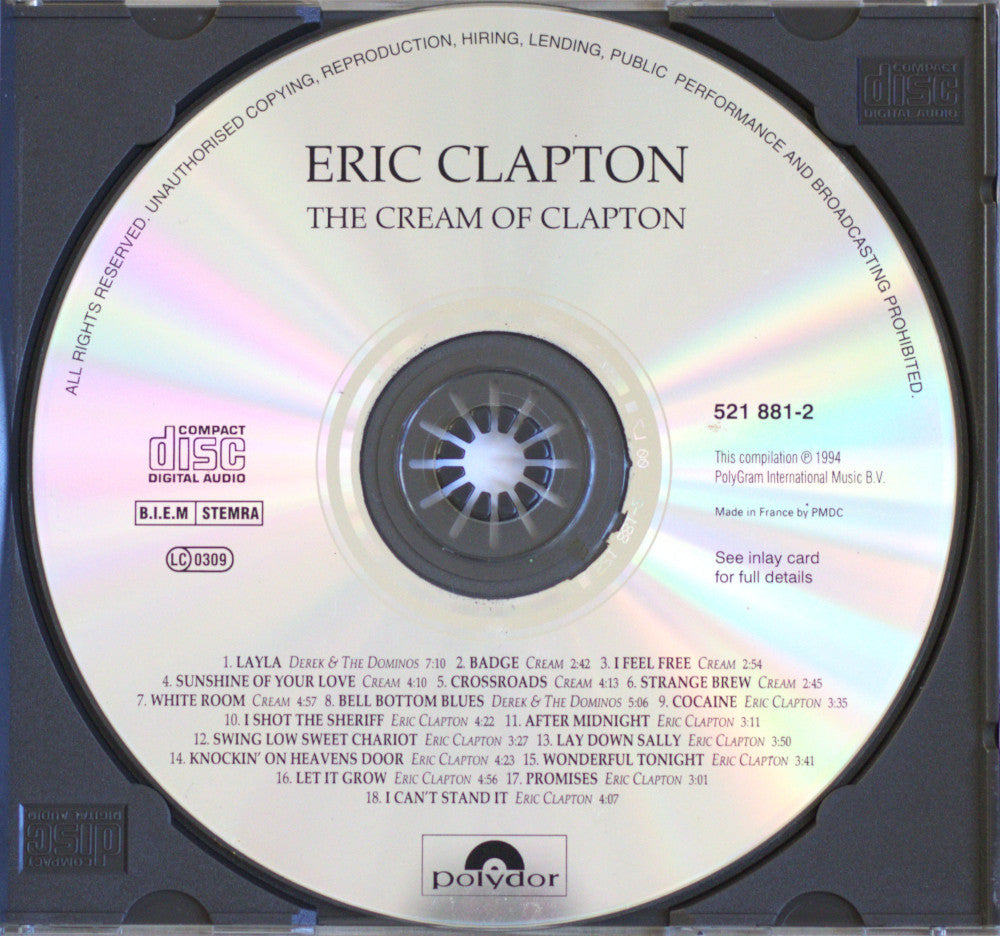 A CD single disc of Eric Clapton's 'The Cream of Clapton' on a white background, showing the reflective silver disc with printed tracklist and Polydor branding.
