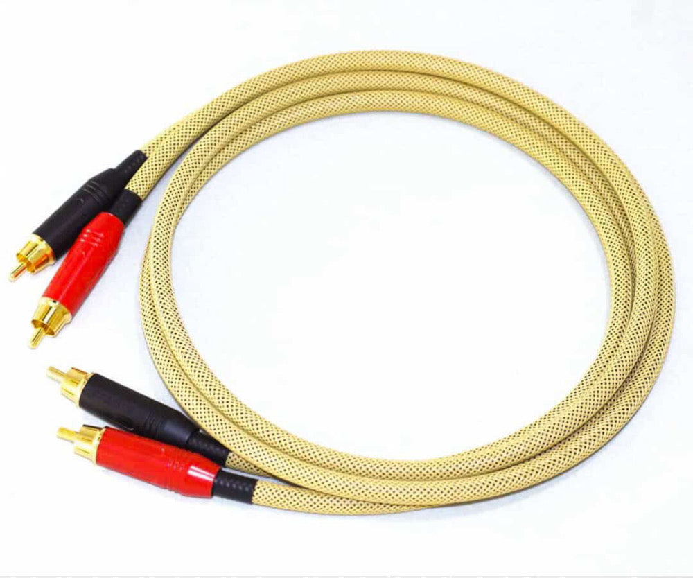 Coiled audio cable with red and black connectors on a white background