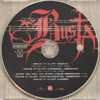 A music CD disc for 'Busta Rhymes Make It Clap' by Sean Paul & Spliff Star, featuring a black disc with red gothic lettering and tracklist text, photographed inside a clear jewel case on a light wood surface.