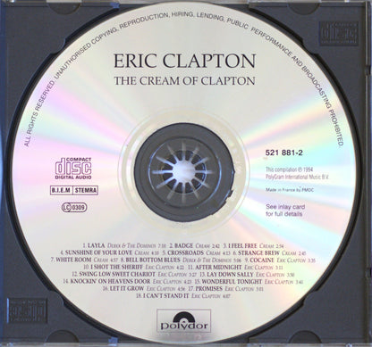 A CD single disc of Eric Clapton's 'The Cream of Clapton' on a white background, showing the reflective silver disc with printed tracklist and Polydor branding.