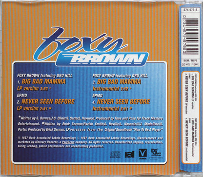 Back cover of a Foxy Brown CD single, showing tracklist text on a blue panel over an orange striped background, with a barcode and spine visible on the right.