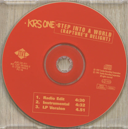 A red CD disc for KRS One's 'Step Into A World (Rapture's Delight)' on IVE, photographed inside a clear plastic jewel case on a light wood surface.