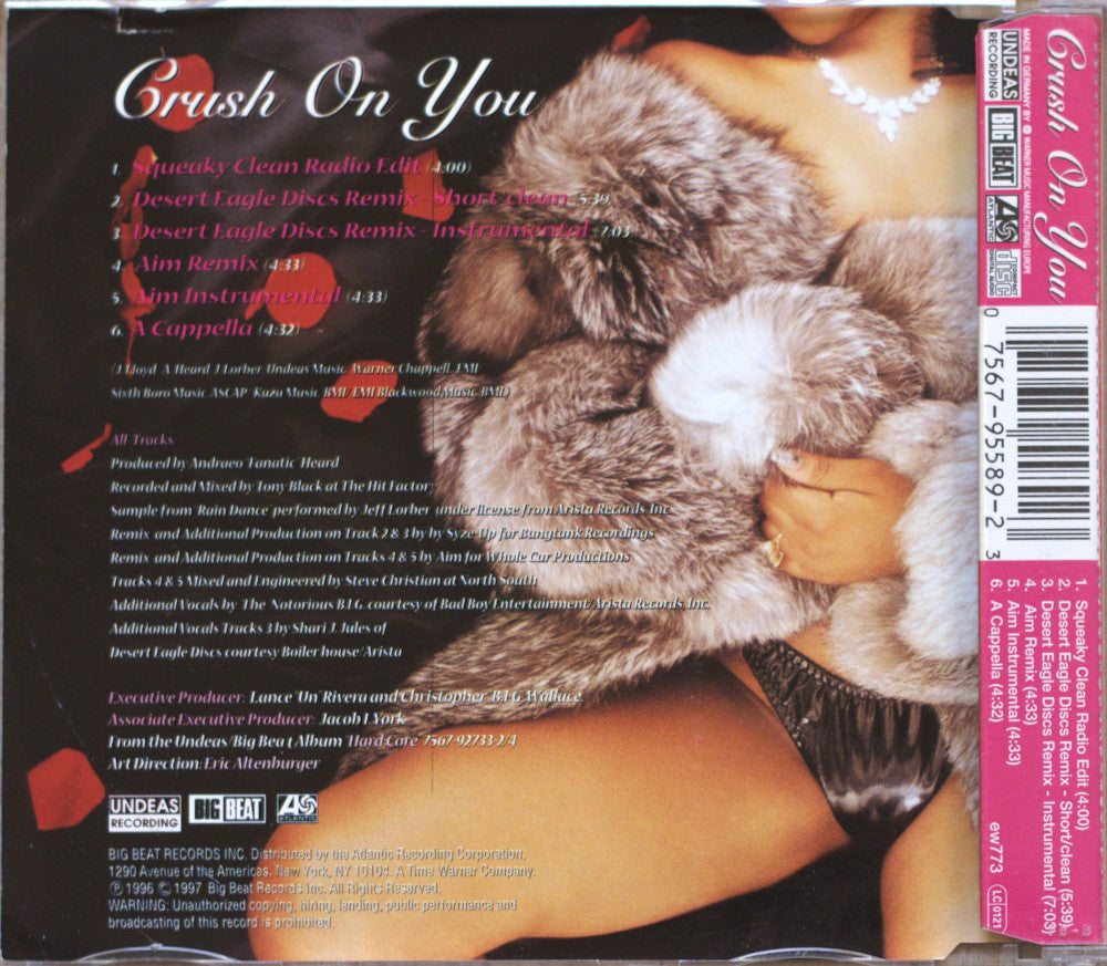 The back cover of a CD single  titled 'Crush On You' by Lil Kim, featuring a close-up photo of a fluffy gray and white cat on the cover, with tracklist, credits, and barcode details.