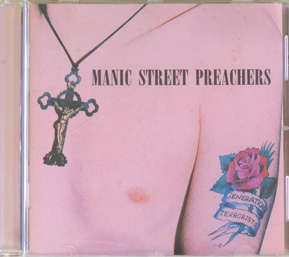 CD cover for the album 'Manic Street Preachers' featuring a pale pink background with a crucifix pendant, a small mole, and a tattooed arm with a pink rose and banner reading 'Generation Terrorist'.