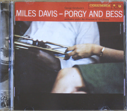 Miles Davis - Porgy and Bess CD album cover on a clear jewel case, featuring a red title band, a photo of a trumpet player, and Columbia LP branding.