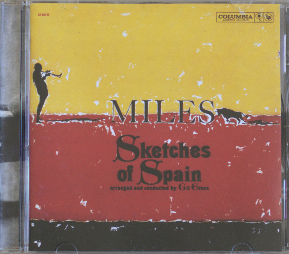 Miles Sketches of Spain CD album cover by Gil Eljas, released on Columbia Records. The cover features a bold yellow and red horizontal split with a black silhouette of a violinist on the left and a cactus on the right.