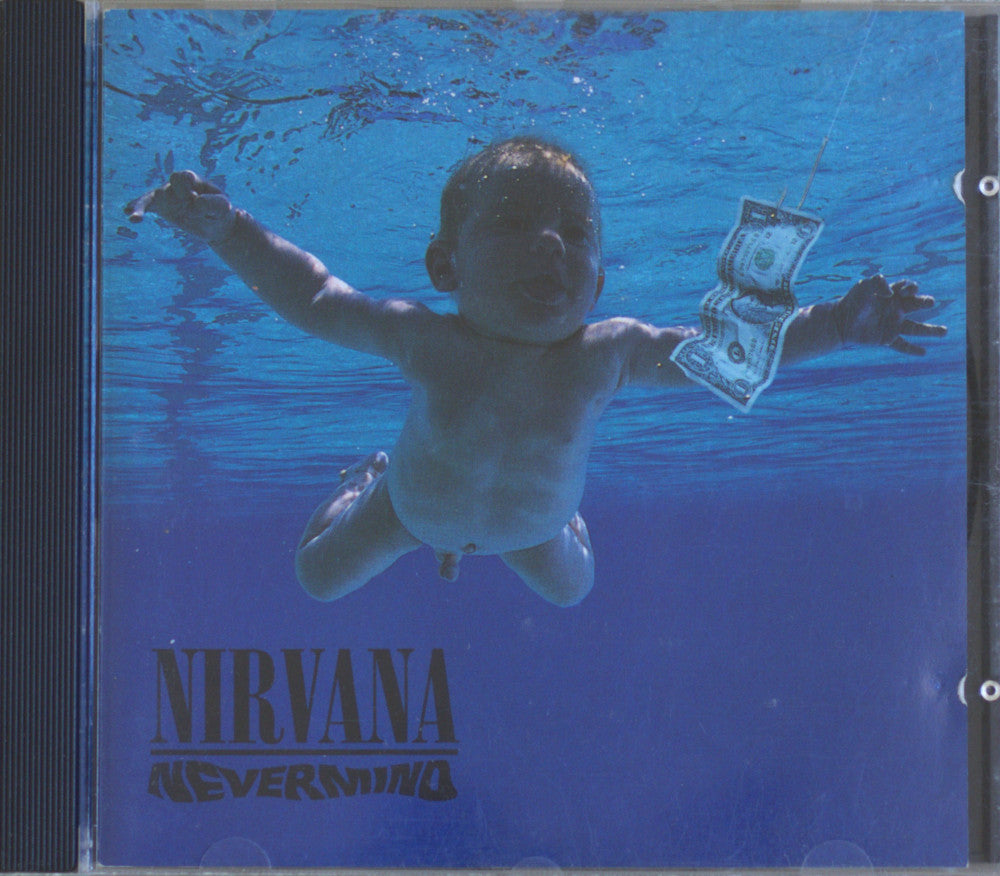Nirvana - Never Mind album cover art showing a baby floating underwater with a dollar bill, inside a CD case.