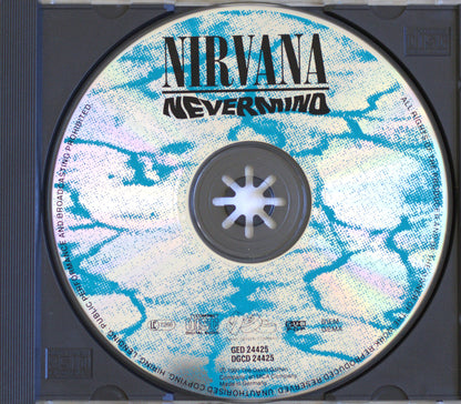 A Nirvana 'Nevermind' CD disc inside a black jewel case, showing the front cover artwork with blue and white marbled design and black text.