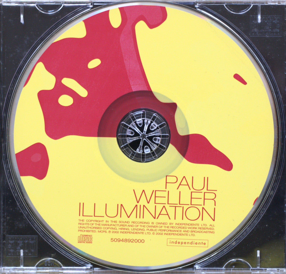 A CD disc for Paul Weller's album 'Illumination' on the Independent label, featuring a yellow background with red abstract paint splatters and the artist's name printed in red.