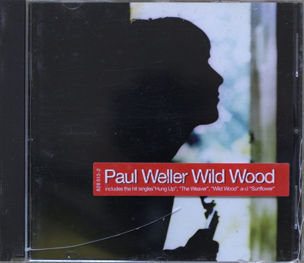 CD cover for Paul Weller's album 'Wild Wood', featuring a black silhouette of a man in profile against a light background with a red title band at the bottom.