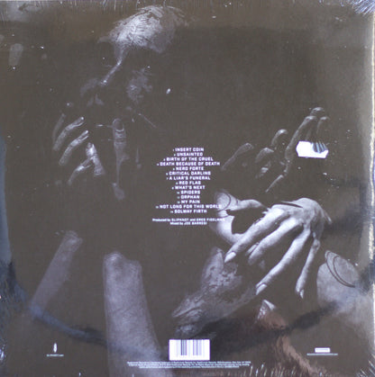The back cover of a physical music release, likely a vinyl record, featuring a dark, gritty black and white graphic of skeletal hands and a face. The tracklist is printed in white text in the center, and a barcode is visible at the bottom.