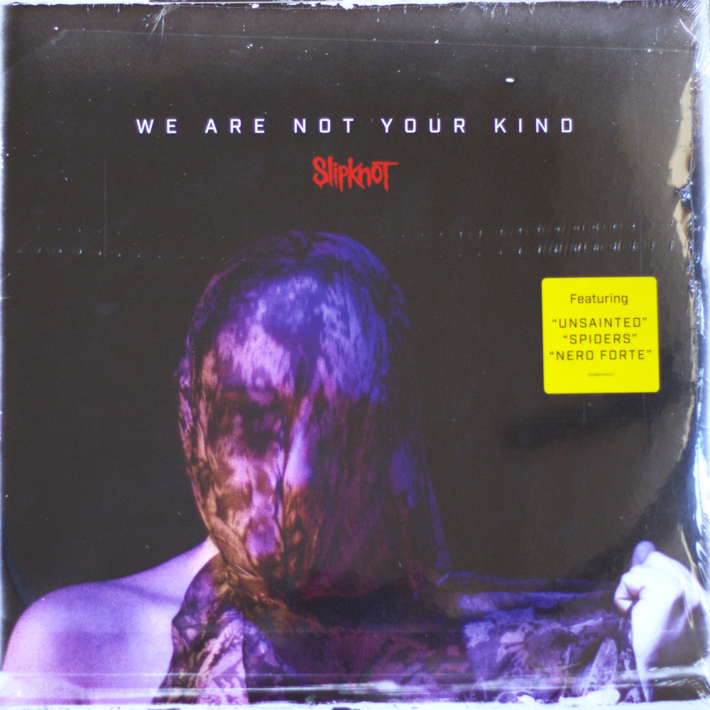 Slipknot 'We Are Not Your Kind' vinyl record cover, sealed in plastic shrink wrap. The cover art features a dark, moody portrait of a person wrapped in a bloody bandage, with the band's name in red and the yellow 'Featuring' sticker on the right.