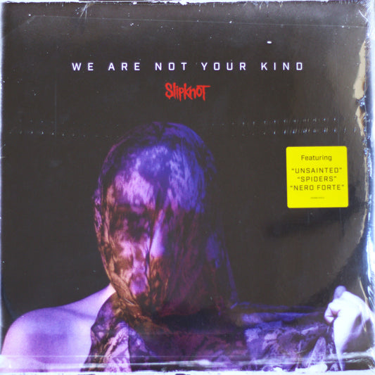 Slipknot 'We Are Not Your Kind' vinyl record cover, sealed in plastic shrink wrap. The cover art features a dark, moody portrait of a person wrapped in a bloody bandage, with the band's name in red and the yellow 'Featuring' sticker on the right.