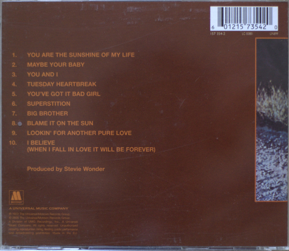 Back cover of a music CD for Stevie Wonder's album 'Talking Book', showing tracklist, barcode, and Universal Music Company branding on a brown background.