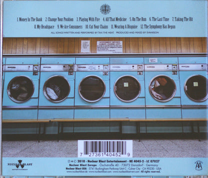 Back cover of a music CD for 'That's The Heat' by Nuclear Blast Entertainment, featuring a row of vintage light blue washing machines with a tracklist at the top and barcode at the bottom.