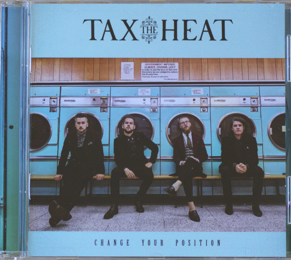 CD cover for the band TAX THE HEAT's album 'CHANGE YOUR POSITION', featuring a photo of four men sitting on a bench in front of turquoise laundries.