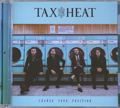 CD cover for the band TAX THE HEAT's album 'CHANGE YOUR POSITION', featuring a photo of four men sitting on a bench in front of turquoise laundries.
