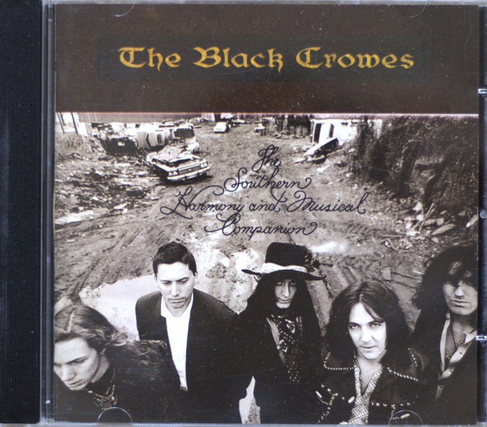CD cover for 'Big Southern Harmony and Musical Companion' by The Black Crowes, showing the band members in front of a construction site scene.