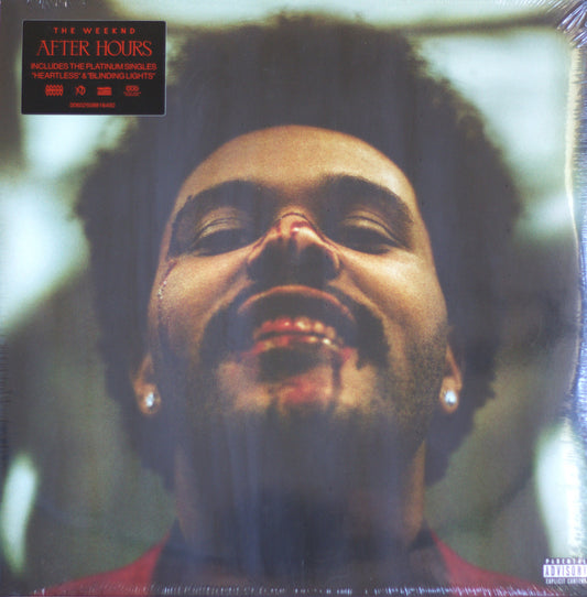 The Weeknd 'After Hours' vinyl record cover, sealed in shrink wrap, featuring a close-up portrait of the artist with a black hairpiece and a red shirt. A black sticker in the top-left corner lists included tracks, and a Parental Advisory label is visible in the bottom-right corner.
